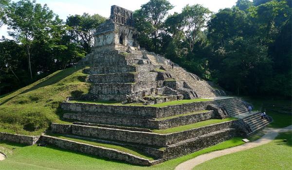 Pyramid half overgrown with jungle